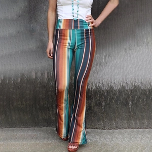 High-waisted flared trousers with vertical retro bohemian stripes in earth tones