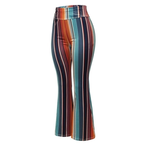 Detail of high waisted flare pants with vintage bohemian vertical striped pattern
