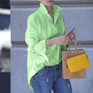 Women's loose long sleeve blouse in vibrant neon green with chic cuff bow ties