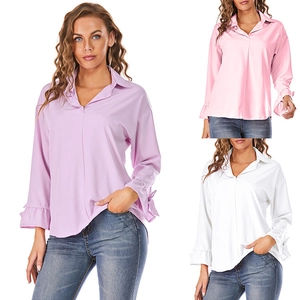 Detail of ruffle cuffs with bow tie ribbons on lightweight long sleeve satin shirt