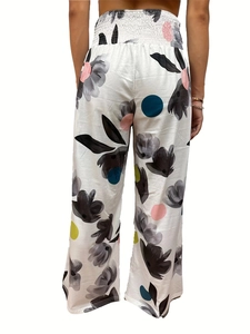 Rear view of high-waisted wide-leg trousers with elegant floral print and elastic waist