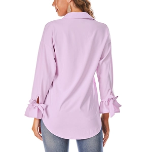 Detail of lavender blouse featuring bow-tied cuffs and ruffled sleeves with round hem