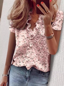 Pink short sleeve floral blouse with V-neck ruffle detail and white flower patterns