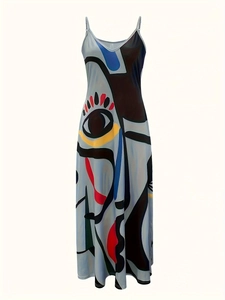 Detail of artistic print on maxi dress showing vibrant colors and abstract eye patterns