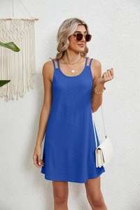 Detail showing blue hollowed-out crochet dress with delicate geometric lace texture