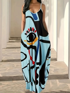 Women's V-neck slip dress with colorful abstract face print on light blue fabric