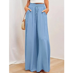 Macro detail of light blue high-waisted wide-leg pants featuring drawstring and side pockets