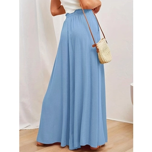 Macro detail of high-waisted elastic waist on light blue linen blend wide leg trousers
