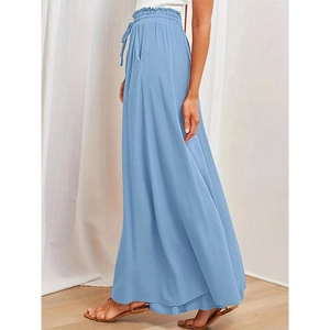 Detail of high waisted wide leg trousers featuring elastic waist and ruffled drawstring