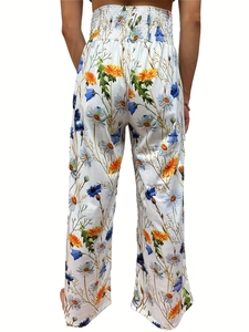 Detail of high waist elastic smocked waistband on floral wide leg trousers for women