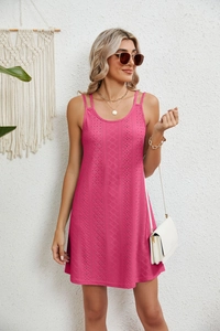 Close-up of fuchsia eyelet embroidery and double strap detail on summer mini dress
