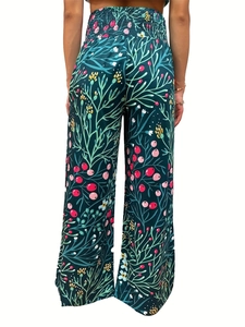 Detail of smocked high waist and botanical print on these loose wide-leg trousers