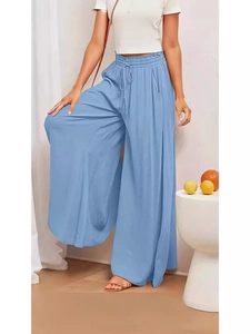 Women's sky blue high waist wide leg trousers with drawstring waist in a minimalist setting