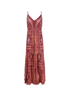 Detail of bohemian maxi dress showing floral print, V-neck, and tiered skirt layers