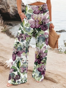 Close-up of floral print wide-leg pants with elastic pleated waist for beach vacation