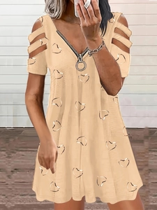 Detail of V-neckline with circular zipper and cold shoulder stripe design on floral dress