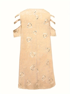 Detail of cold shoulder design with parallel straps and white heart pattern on beige dress