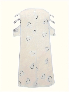 Close-up of heart-shaped cutouts and layered hollow shoulder bands on a white dress