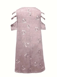 Detail of cold shoulder design with multi-strap sleeve and heart print on a V-neck dress
