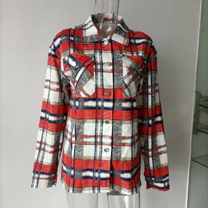 Detail of red and grey plaid wool jacket showing turn-down collar and chest pockets