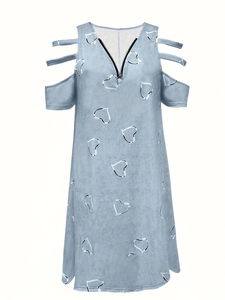 Detail of light blue cold shoulder dress featuring V-neck zipper and white heart print