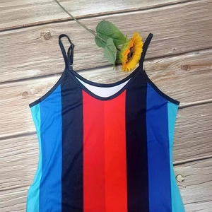 Fashionable women's V-neck camisole dress with vibrant vertical stripes on wooden floor