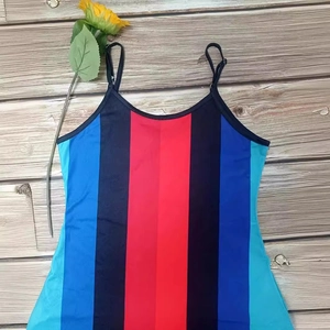 Plus size summer maxi dress with vibrant vertical stripes and thin spaghetti straps
