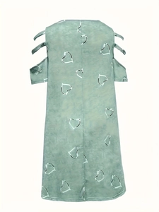 Detail view of cold-shoulder sleeve with triple strap design and white heart prints