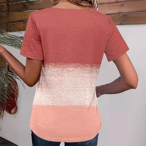Back view of woman in tri-color block T-shirt featuring brick red, beige and pink tones