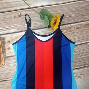 Plus size summer maxi dress featuring bold vertical stripes and spaghetti straps