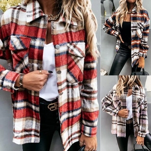Detailed view of women plaid flannel shacket with flap pockets and metallic buttons