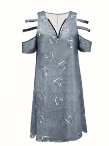 Detail view of V-neck zipper and cold shoulder straps on gray heart print dress