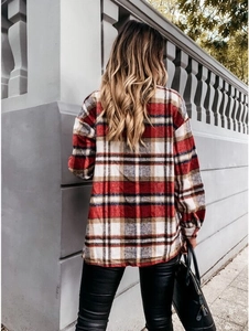 Back view of a thick red and white plaid flannel shirt jacket for women in street style