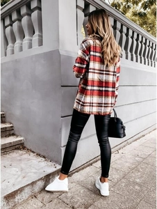 Rear view of a long-sleeved red and white plaid wool blend shirt coat for women