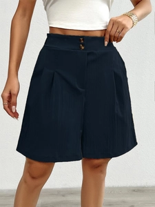 Detail of high waisted wide leg shorts with double button closure and front pleats