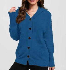 Close-up of royal blue knitted cardigan featuring black buttons and ribbed sleeve cuffs