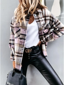 Detail showing pink and brown plaid wool shirt jacket with metal buckle belt and handbag