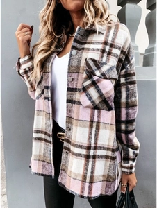 Close-up of pink plaid flannel shacket featuring a turndown collar and flap pockets