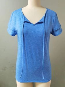 Detailed view of women's blue V-neck T-shirt with layered sleeves and vertical decorative straps
