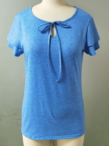 Detail of light blue V-neck T-shirt with hollow-out lace and double-layered ruffle sleeves