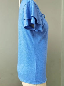 Detail view of double-layered ruffle sleeves on a blue heathered V-neck casual T-shirt