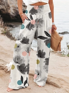 Pantalon large à fleurs pour femme avec taille haute élastique et des poches latérales
