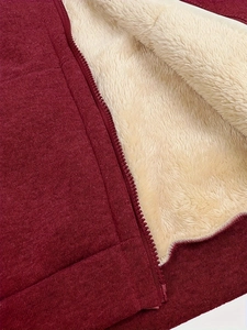 Detailed view of winter hoodie with thick wine red knit fabric and warm sherpa fleece lining