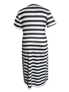 Rear view of long black and white striped short-sleeve maxi dress with round neckline