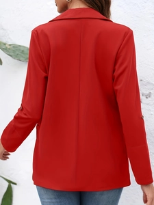 Detail of red blazer back showing lapel design and decorative button straps on sleeves