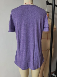 Detail of purple marled texture fabric and layered short sleeve design on the shirt