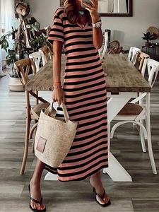 Detail of pink and black striped maxi dress with V-neckline and short sleeves