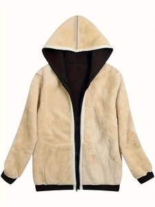 Detail of warm beige faux fur hoodie with black zipper and ribbed cuffs in a loose style
