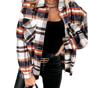 Women's orange plaid flannel shirt jacket with buttons and chest pockets for autumn