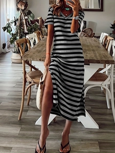Detail of a casual V-neck striped dress with side slit and soft textured fabric